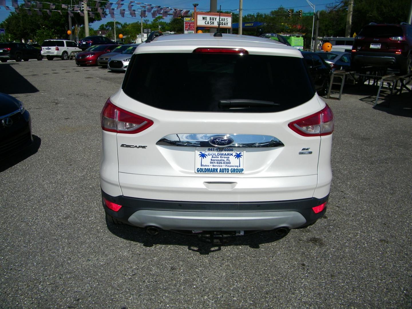 2015 White /BLACK Ford Escape SE 4WD (1FMCU9GX4FU) with an 1.6L L4 DOHC 16V engine, 6-Speed Automatic transmission, located at 4000 Bee Ridge Road, Sarasota, FL, 34233, (941) 926-0300, 27.298664, -82.489151 - Photo#4