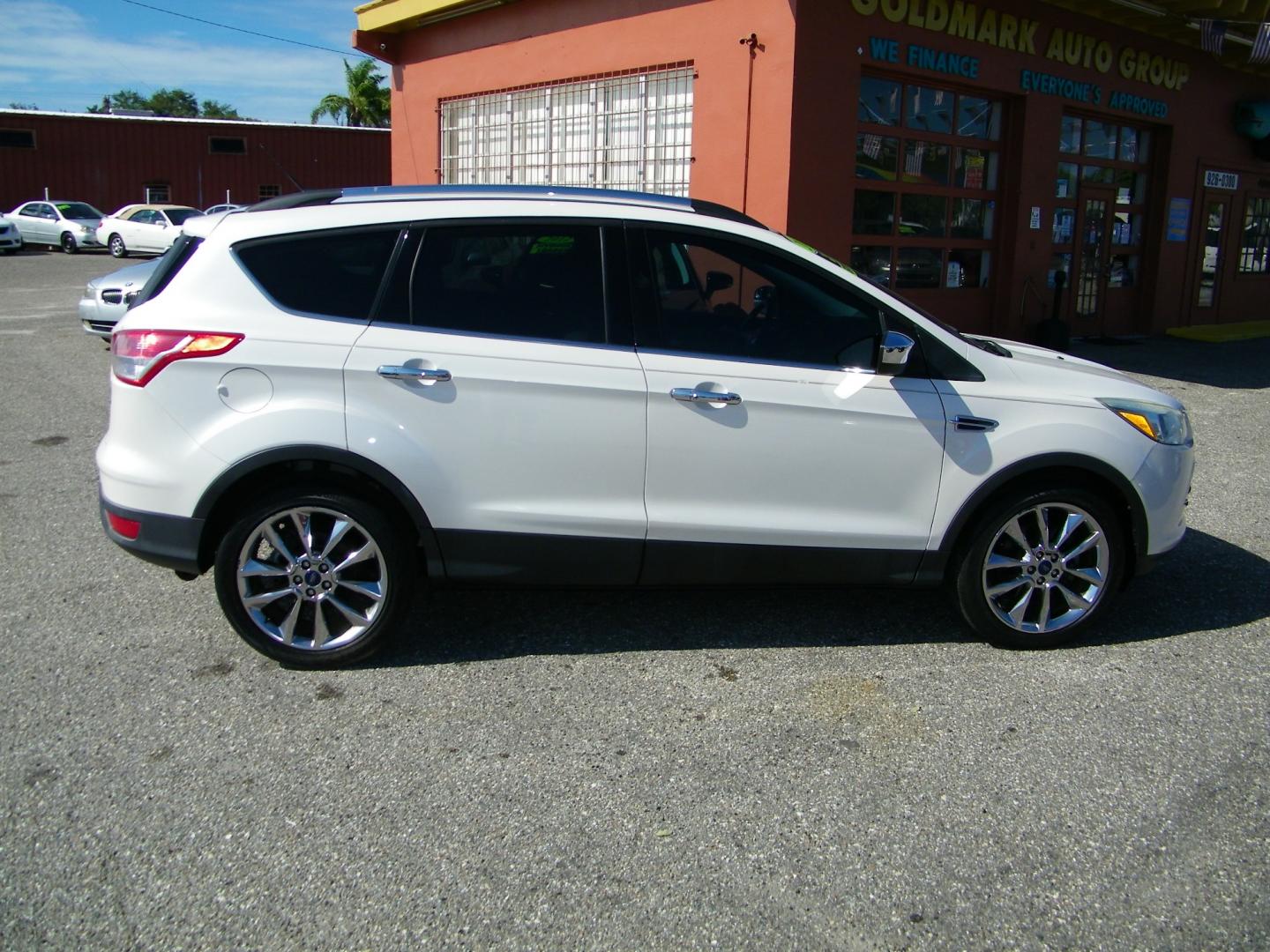 2015 White /BLACK Ford Escape SE 4WD (1FMCU9GX4FU) with an 1.6L L4 DOHC 16V engine, 6-Speed Automatic transmission, located at 4000 Bee Ridge Road, Sarasota, FL, 34233, (941) 926-0300, 27.298664, -82.489151 - Photo#6