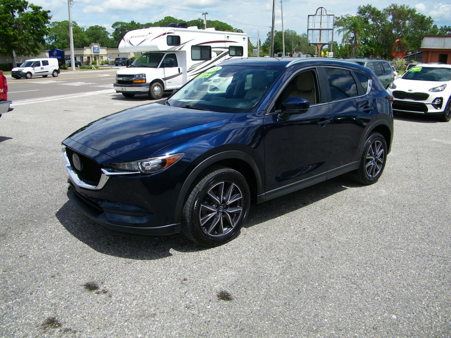 2018 Blue /Black Mazda CX-5 Touring (JM3KFACM2J0) with an 2.5L L4 DOHC 16V engine, Automatic transmission, located at 4000 Bee Ridge Road, Sarasota, FL, 34233, (941) 926-0300, 27.298664, -82.489151 - Photo#0