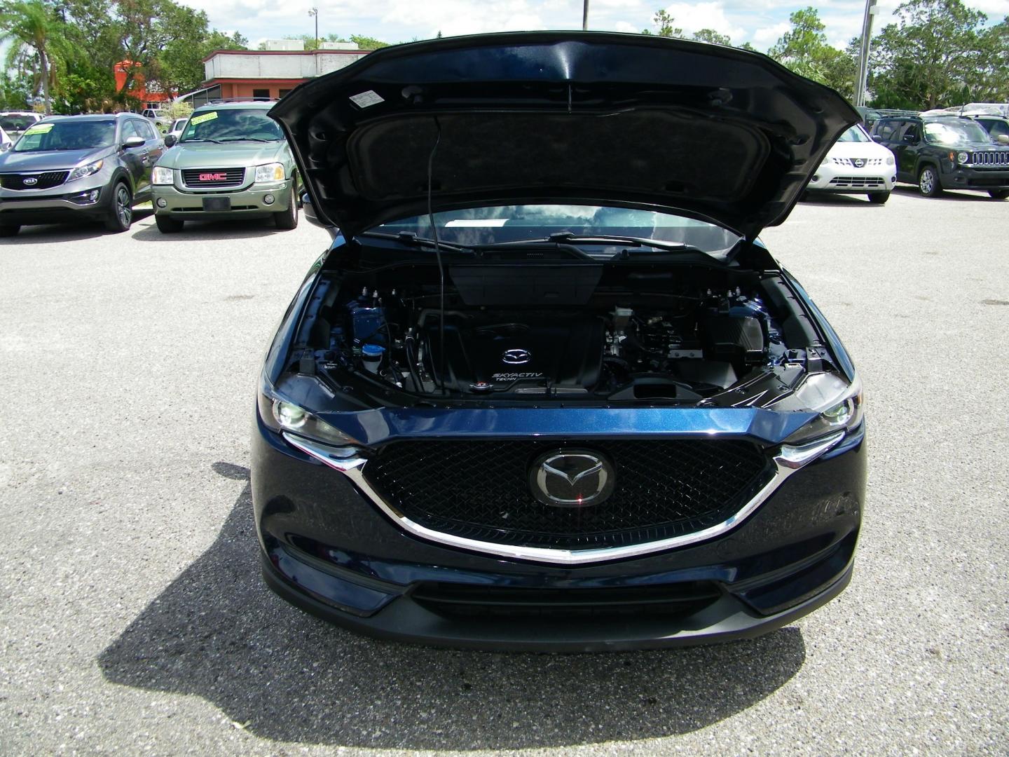 2018 Blue /Black Mazda CX-5 Touring (JM3KFACM2J0) with an 2.5L L4 DOHC 16V engine, Automatic transmission, located at 4000 Bee Ridge Road, Sarasota, FL, 34233, (941) 926-0300, 27.298664, -82.489151 - Photo#9