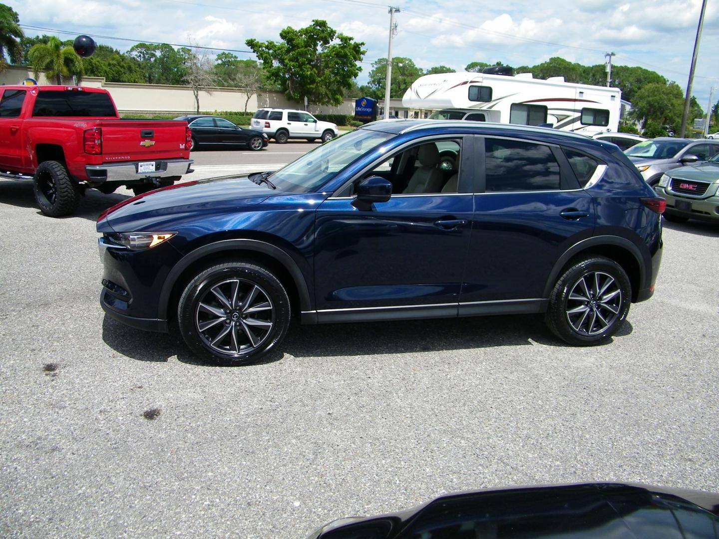 2018 Blue /Black Mazda CX-5 Touring (JM3KFACM2J0) with an 2.5L L4 DOHC 16V engine, Automatic transmission, located at 4000 Bee Ridge Road, Sarasota, FL, 34233, (941) 926-0300, 27.298664, -82.489151 - Photo#2