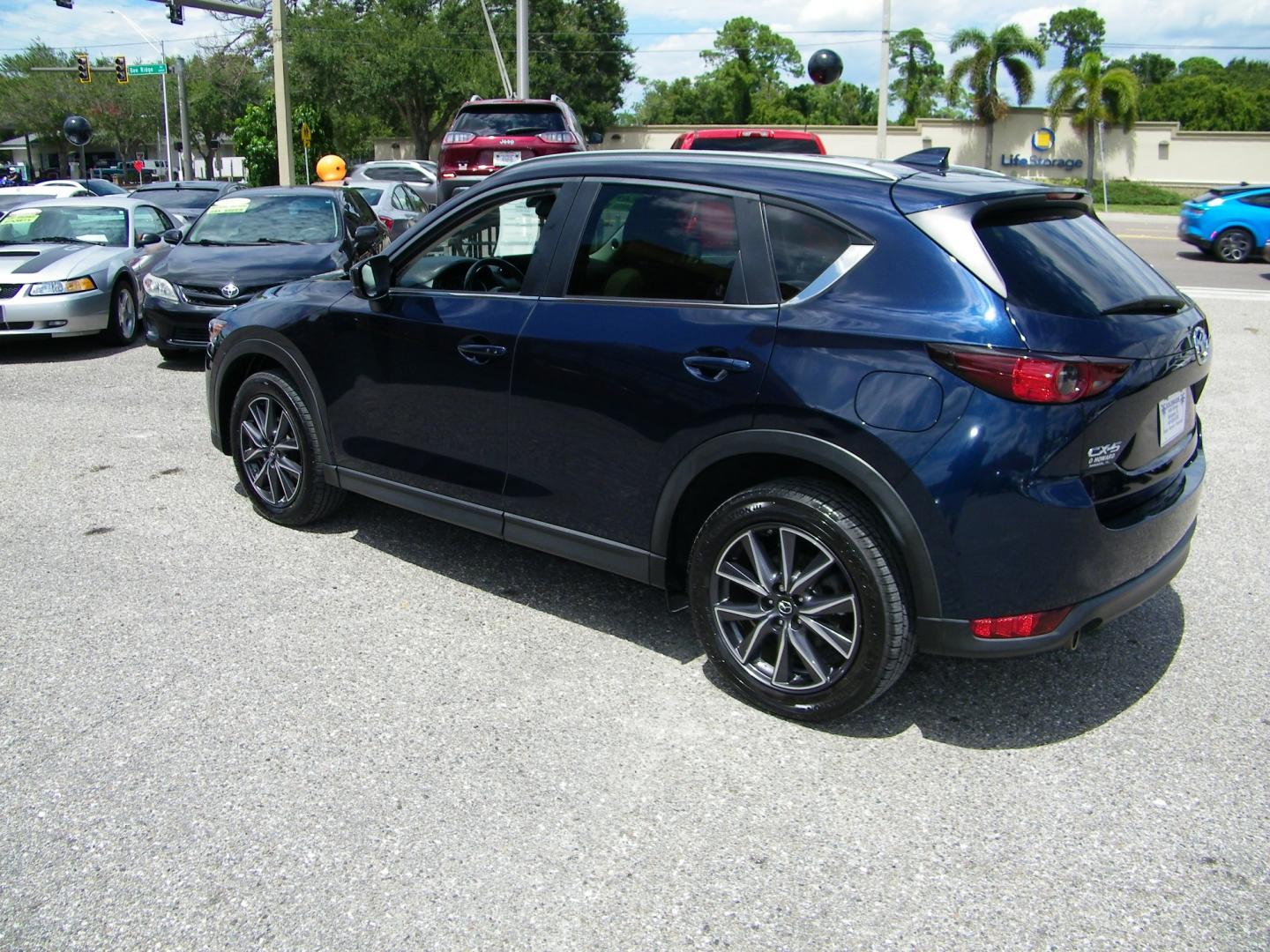 2018 Blue /Black Mazda CX-5 Touring (JM3KFACM2J0) with an 2.5L L4 DOHC 16V engine, Automatic transmission, located at 4000 Bee Ridge Road, Sarasota, FL, 34233, (941) 926-0300, 27.298664, -82.489151 - Photo#3