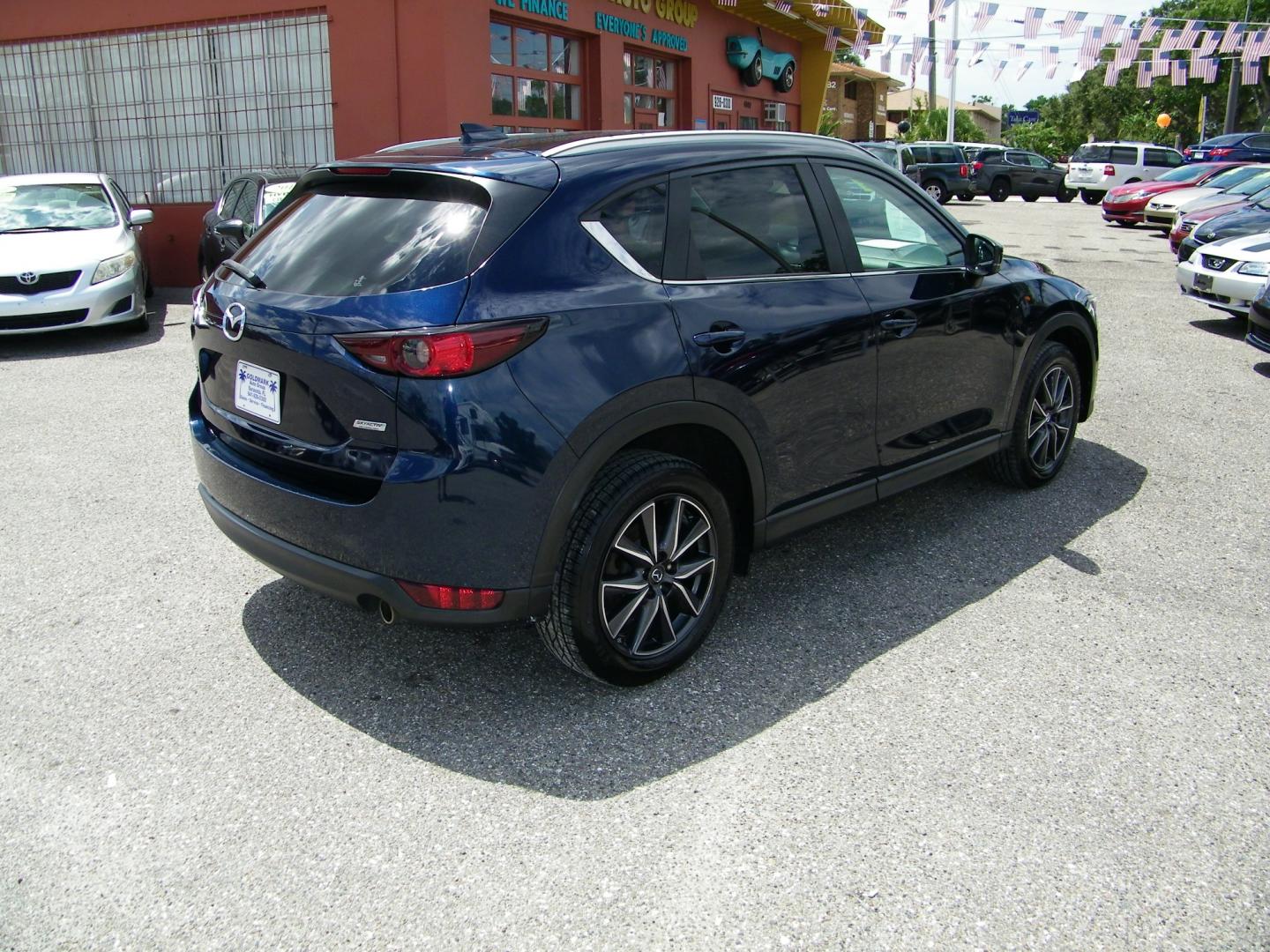 2018 Blue /Black Mazda CX-5 Touring (JM3KFACM2J0) with an 2.5L L4 DOHC 16V engine, Automatic transmission, located at 4000 Bee Ridge Road, Sarasota, FL, 34233, (941) 926-0300, 27.298664, -82.489151 - Photo#5