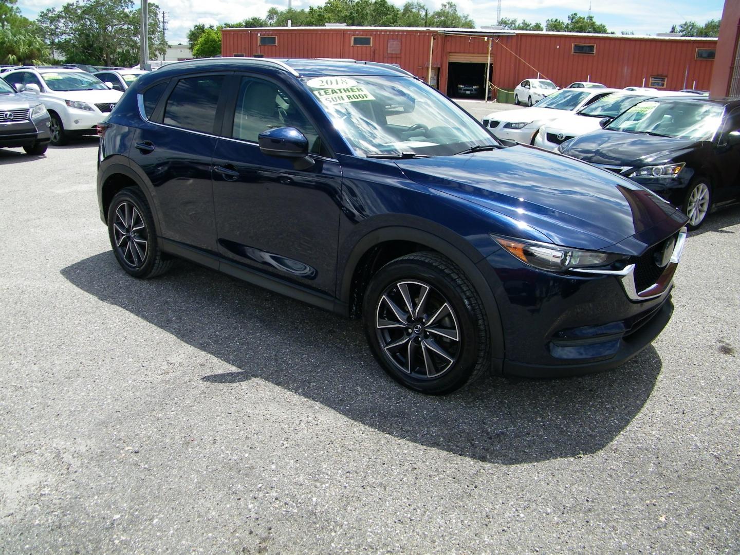 2018 Blue /Black Mazda CX-5 Touring (JM3KFACM2J0) with an 2.5L L4 DOHC 16V engine, Automatic transmission, located at 4000 Bee Ridge Road, Sarasota, FL, 34233, (941) 926-0300, 27.298664, -82.489151 - Photo#7