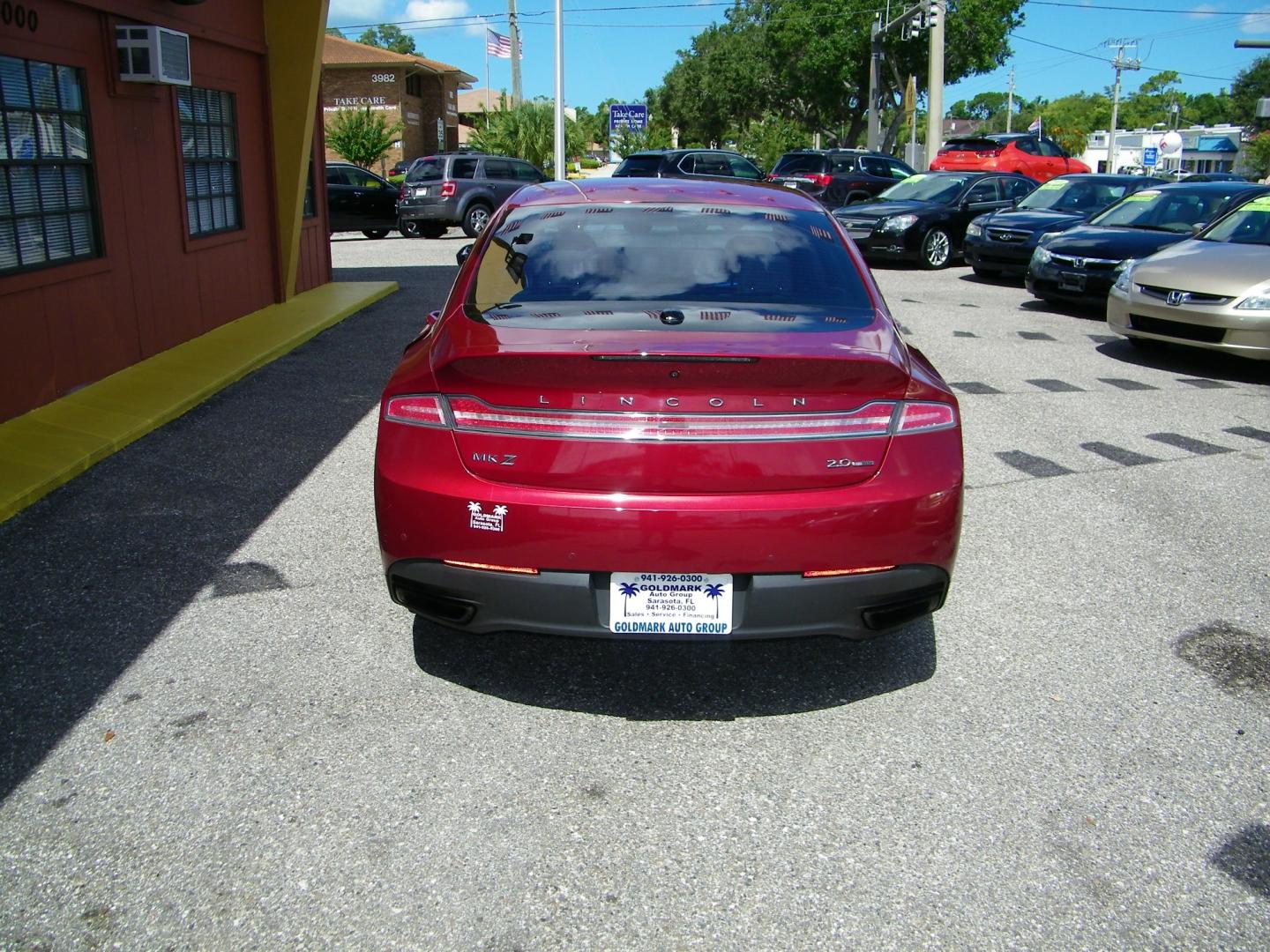 2014 Red /Beige Lincoln MKZ FWD (3LN6L2G93ER) with an 2.0L L4 DOHC 16V engine, 6-Speed Automatic transmission, located at 4000 Bee Ridge Road, Sarasota, FL, 34233, (941) 926-0300, 27.298664, -82.489151 - Photo#21