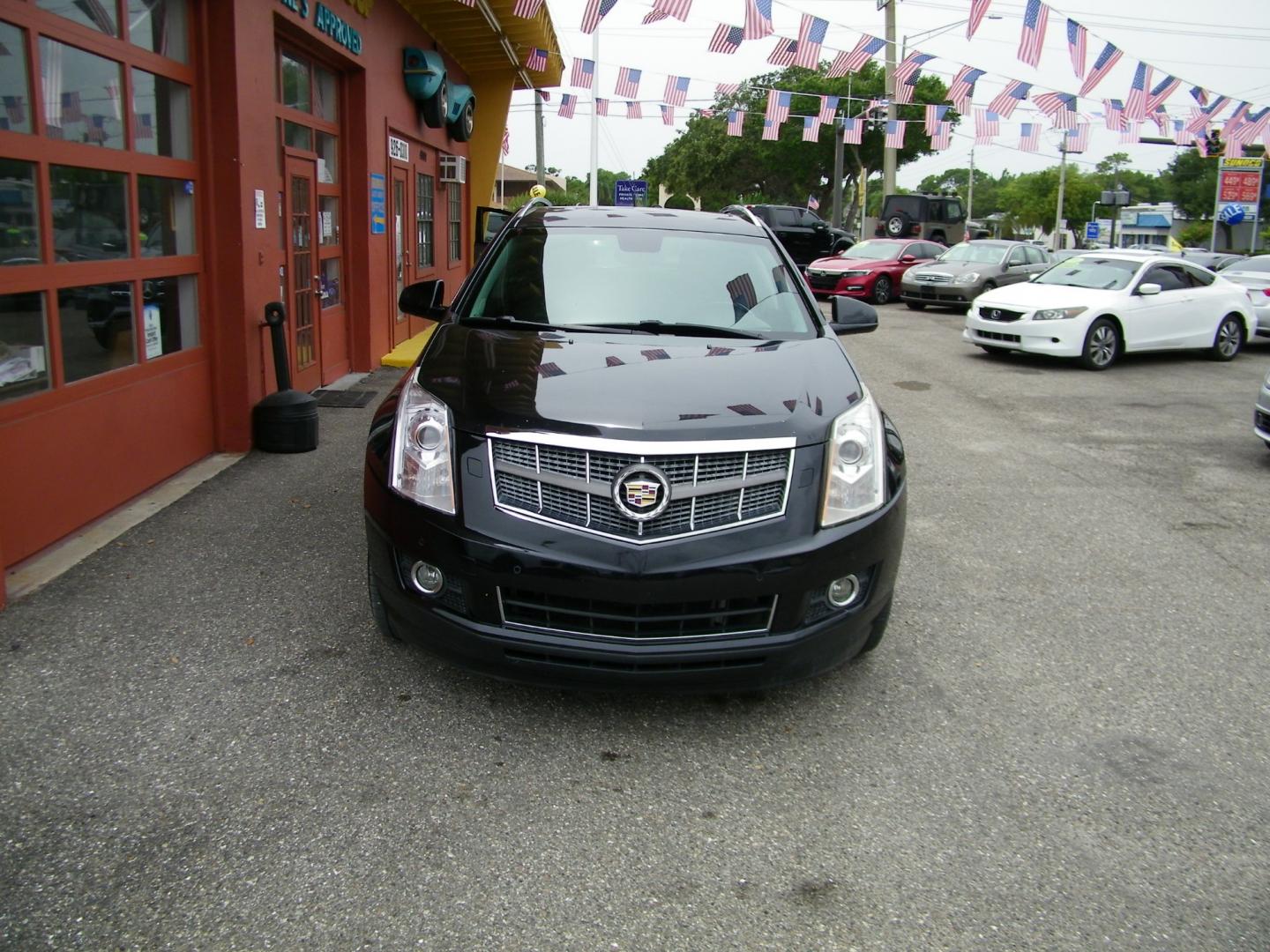 2012 Black /Black Cadillac SRX Premium (3GYFNCE36CS) with an 3.6L V6 DOHC 24V FFV engine, 6-Speed Automatic transmission, located at 4000 Bee Ridge Road, Sarasota, FL, 34233, (941) 926-0300, 27.298664, -82.489151 - Photo#1