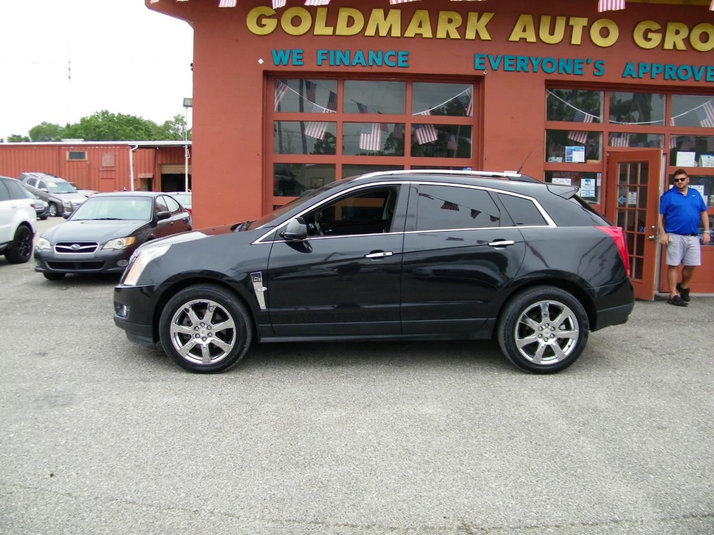 2012 Black /Black Cadillac SRX Premium (3GYFNCE36CS) with an 3.6L V6 DOHC 24V FFV engine, 6-Speed Automatic transmission, located at 4000 Bee Ridge Road, Sarasota, FL, 34233, (941) 926-0300, 27.298664, -82.489151 - Photo#2