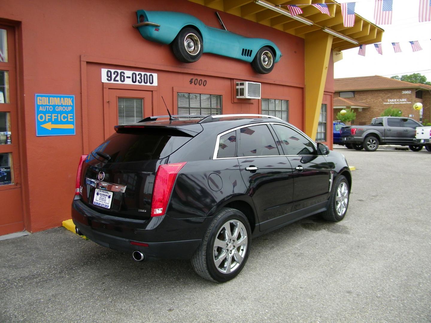 2012 Black /Black Cadillac SRX Premium (3GYFNCE36CS) with an 3.6L V6 DOHC 24V FFV engine, 6-Speed Automatic transmission, located at 4000 Bee Ridge Road, Sarasota, FL, 34233, (941) 926-0300, 27.298664, -82.489151 - Photo#6