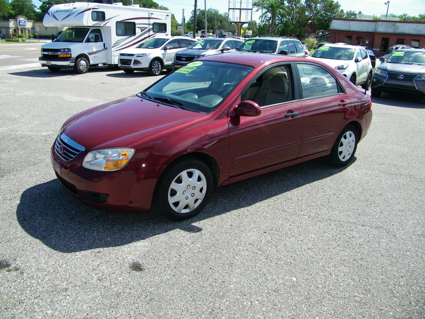 2007 Maroon /Beige Kia Spectra EX (KNAFE121075) with an 2.0L L4 DOHC 16V engine, Automatic transmission, located at 4000 Bee Ridge Road, Sarasota, FL, 34233, (941) 926-0300, 27.298664, -82.489151 - Photo#0