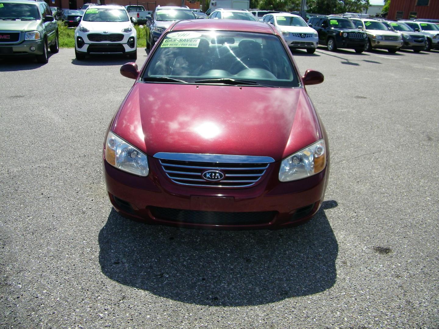 2007 Maroon /Beige Kia Spectra EX (KNAFE121075) with an 2.0L L4 DOHC 16V engine, Automatic transmission, located at 4000 Bee Ridge Road, Sarasota, FL, 34233, (941) 926-0300, 27.298664, -82.489151 - Photo#1