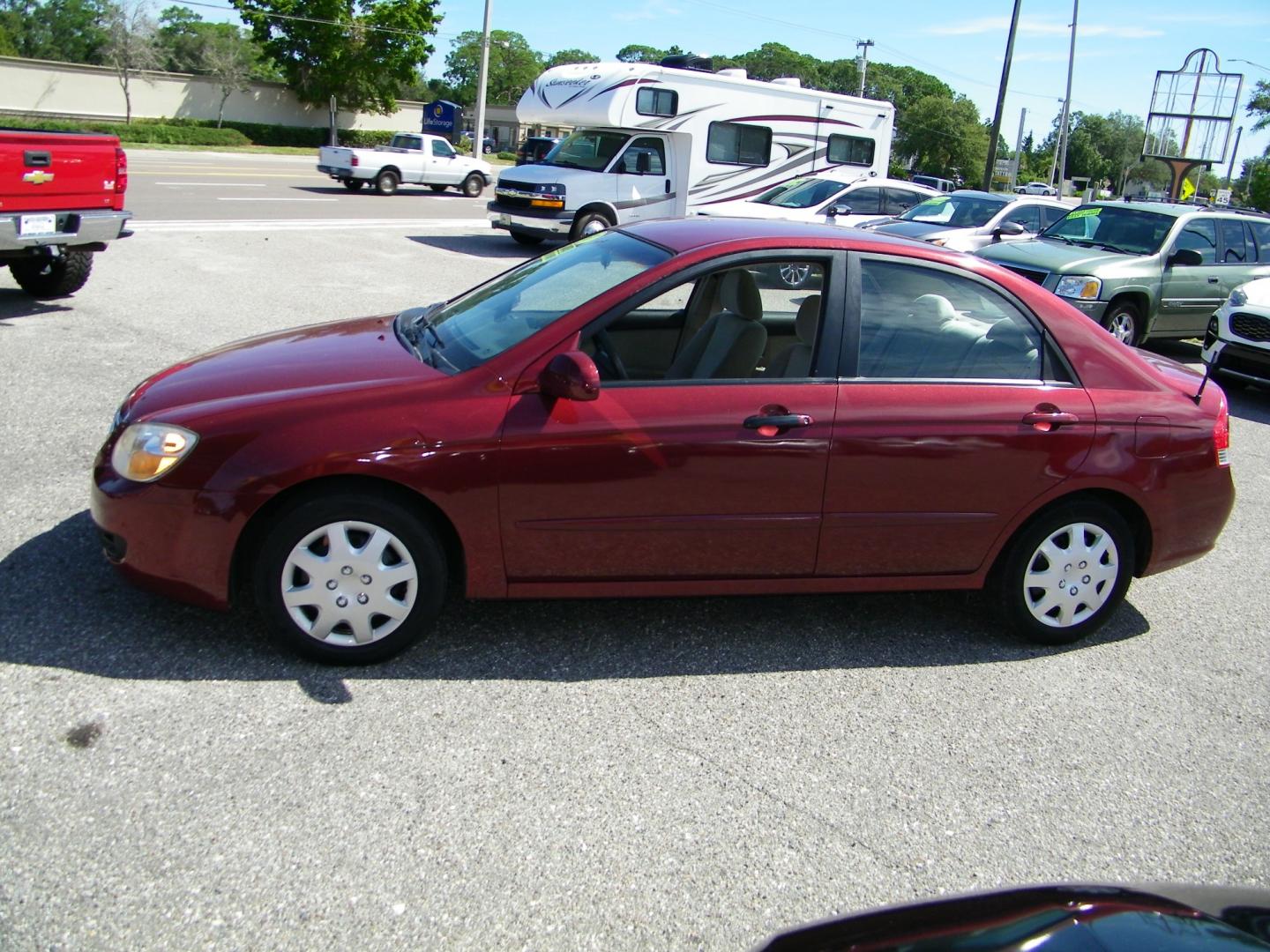 2007 Maroon /Beige Kia Spectra EX (KNAFE121075) with an 2.0L L4 DOHC 16V engine, Automatic transmission, located at 4000 Bee Ridge Road, Sarasota, FL, 34233, (941) 926-0300, 27.298664, -82.489151 - Photo#2