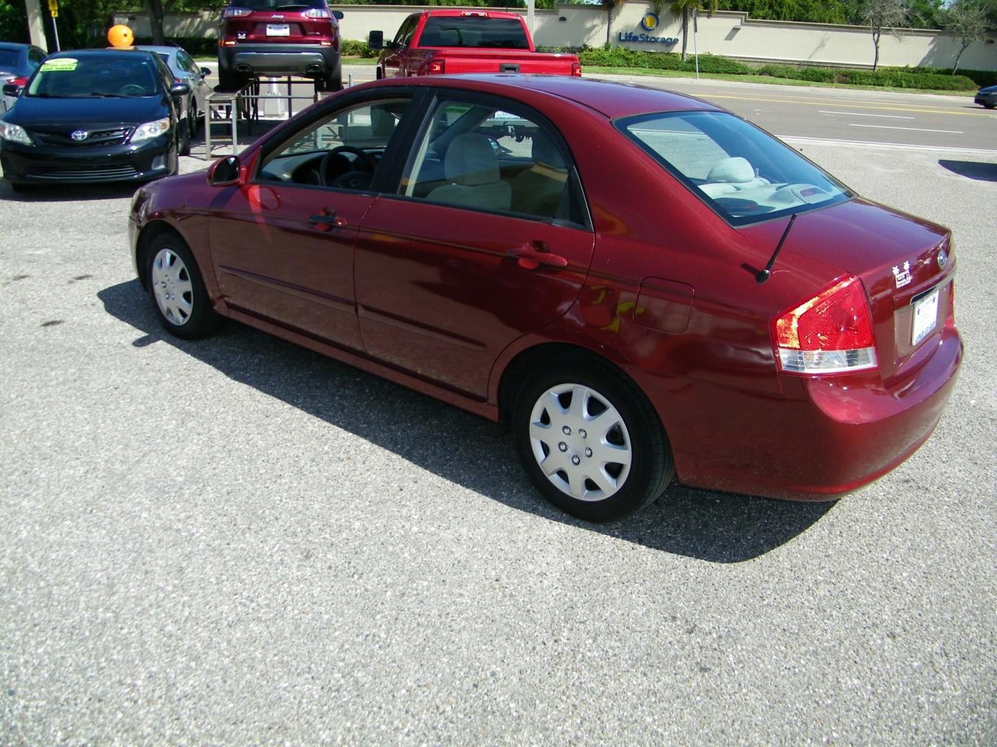 2007 Maroon /Beige Kia Spectra EX (KNAFE121075) with an 2.0L L4 DOHC 16V engine, Automatic transmission, located at 4000 Bee Ridge Road, Sarasota, FL, 34233, (941) 926-0300, 27.298664, -82.489151 - Photo#3