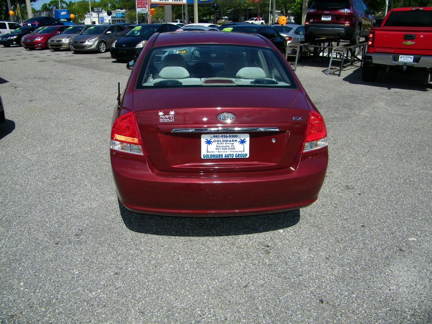 2007 Maroon /Beige Kia Spectra EX (KNAFE121075) with an 2.0L L4 DOHC 16V engine, Automatic transmission, located at 4000 Bee Ridge Road, Sarasota, FL, 34233, (941) 926-0300, 27.298664, -82.489151 - Photo#4