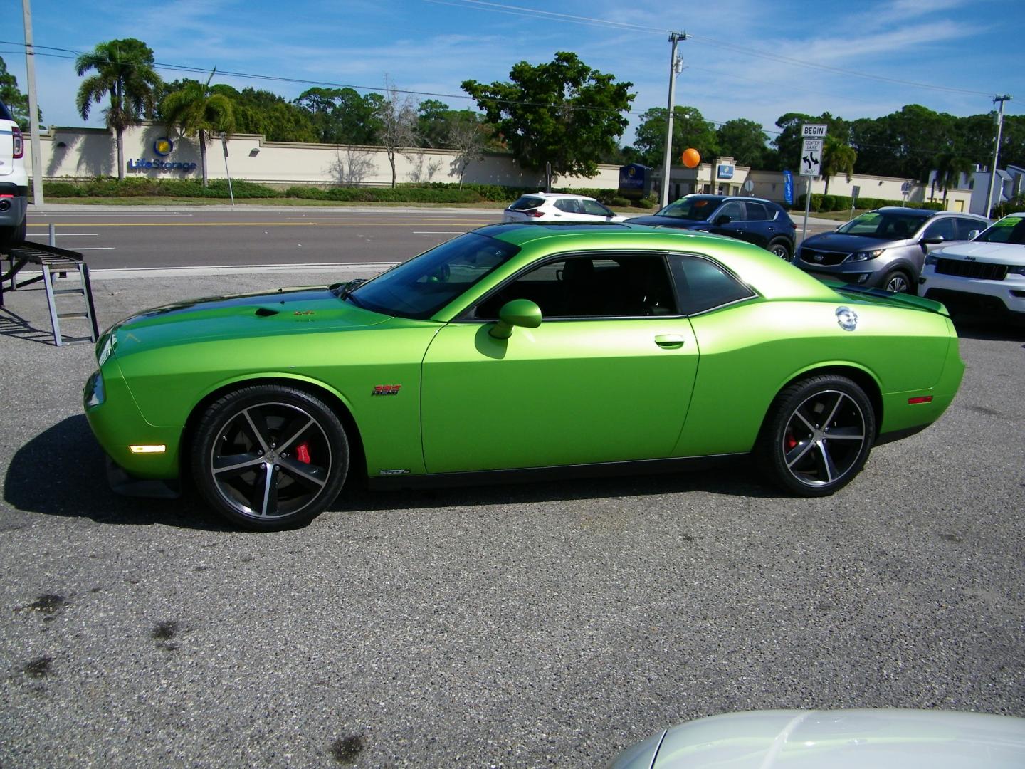 2011 Green /Black Dodge Challenger SRT8 (2B3CJ7DJ9BH) with an 6.4L V8 OHV 16V engine, 5-Speed Automatic transmission, located at 4000 Bee Ridge Road, Sarasota, FL, 34233, (941) 926-0300, 27.298664, -82.489151 - Photo#2