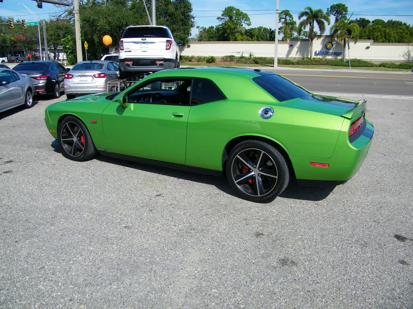 2011 Green /Black Dodge Challenger SRT8 (2B3CJ7DJ9BH) with an 6.4L V8 OHV 16V engine, 5-Speed Automatic transmission, located at 4000 Bee Ridge Road, Sarasota, FL, 34233, (941) 926-0300, 27.298664, -82.489151 - Photo#3