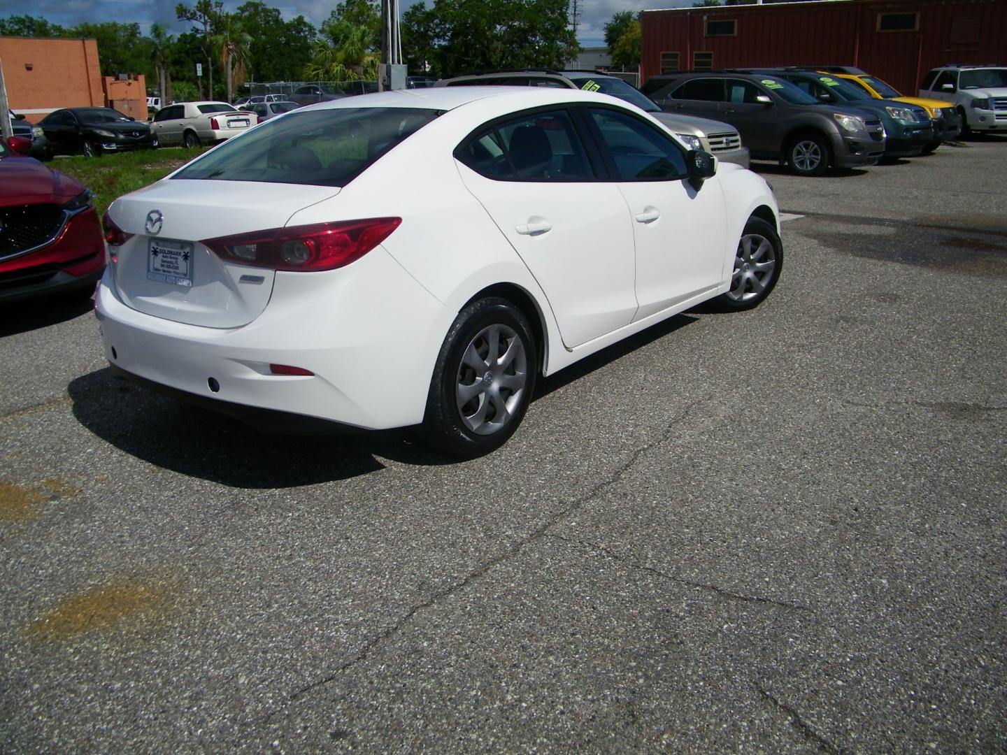 2015 White /Beige Mazda MAZDA3 iSport (3MZBM1U79FM) with an 2.0L I4 engine, Automatic transmission, located at 4000 Bee Ridge Road, Sarasota, FL, 34233, (941) 926-0300, 27.298664, -82.489151 - Photo#4