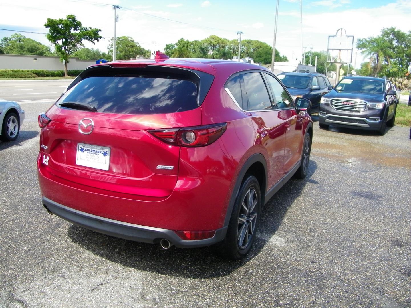 2017 Red /Beige Mazda CX-5 Grand Touring (JM3KFADL4H0) with an 2.5L I4 engine, Automatic transmission, located at 4000 Bee Ridge Road, Sarasota, FL, 34233, (941) 926-0300, 27.298664, -82.489151 - Photo#4