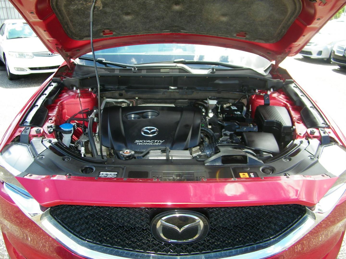 2017 Red /Beige Mazda CX-5 Grand Touring (JM3KFADL4H0) with an 2.5L I4 engine, Automatic transmission, located at 4000 Bee Ridge Road, Sarasota, FL, 34233, (941) 926-0300, 27.298664, -82.489151 - Photo#5