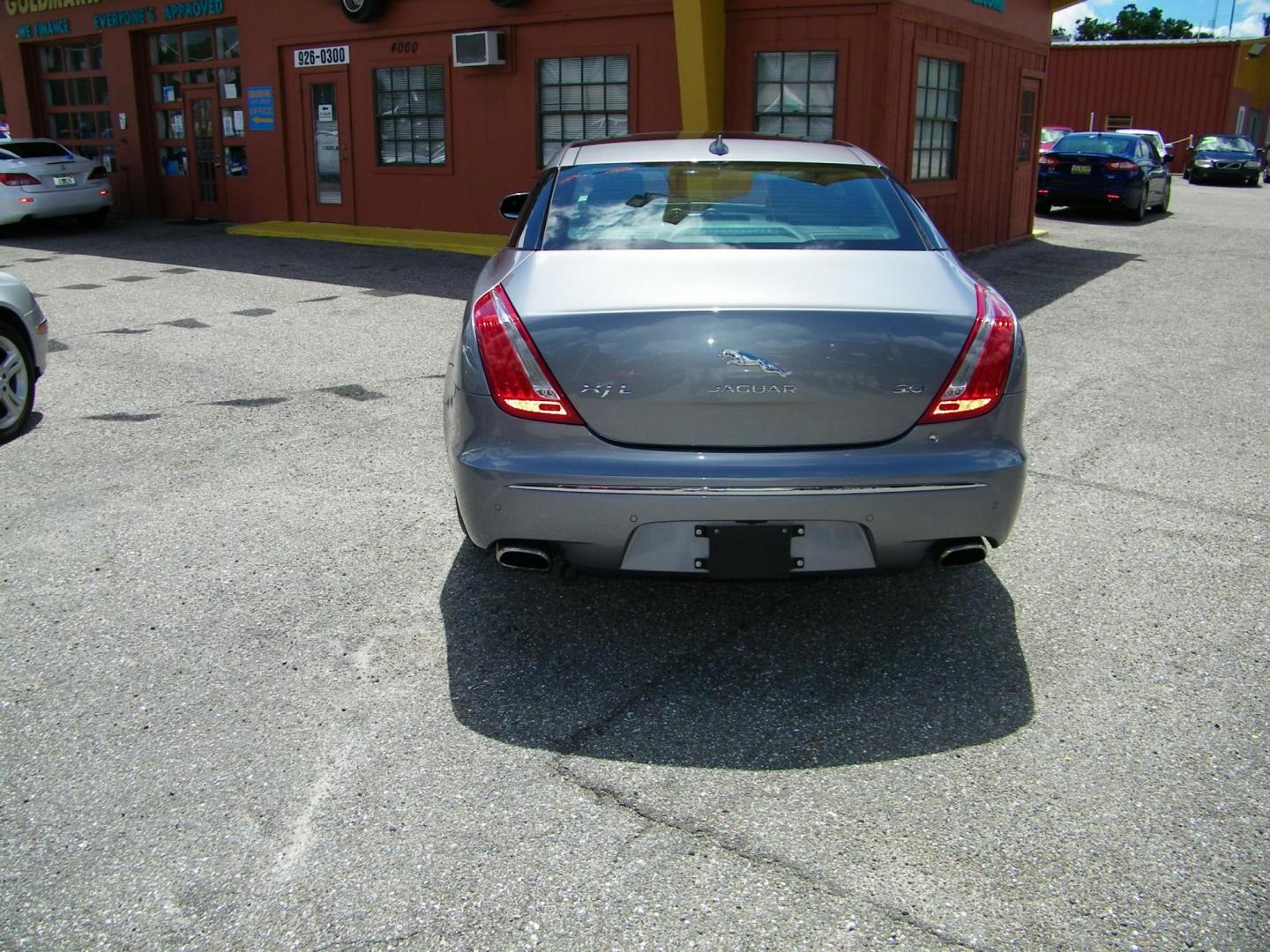 2014 /Black Jaguar XJ-Series XJL Portfolio (SAJWA2GZXE8) with an 3.0L V6 DOHC 24V FFV engine, 8-Speed Automatic transmission, located at 4000 Bee Ridge Road, Sarasota, FL, 34233, (941) 926-0300, 27.298664, -82.489151 - Photo#4