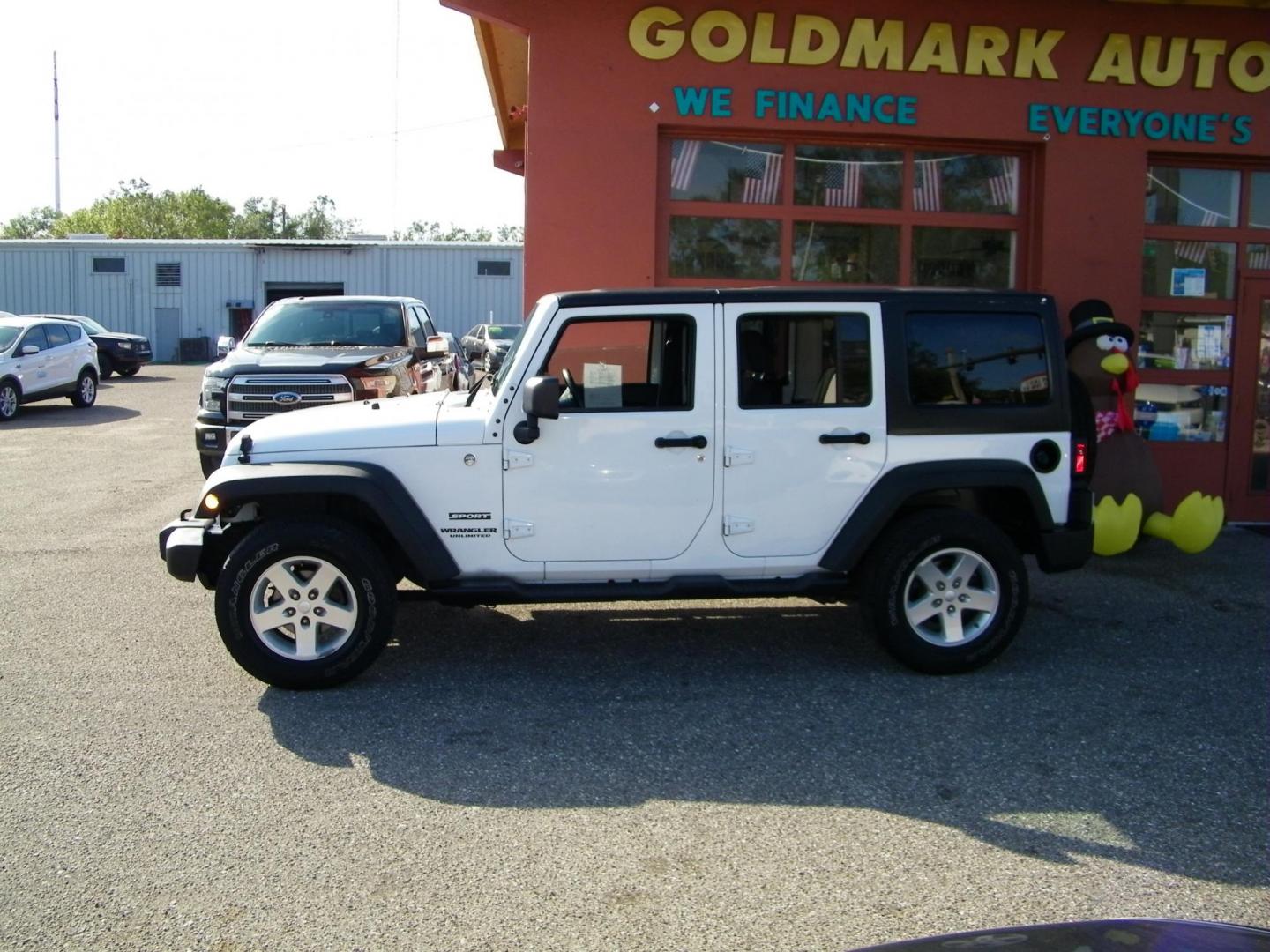 2015 White /Black Jeep Wrangler Unlimited Sport 4WD (1C4BJWDG4FL) with an 3.6L V6 DOHC 24V FFV engine, Automatic transmission, located at 4000 Bee Ridge Road, Sarasota, FL, 34233, (941) 926-0300, 27.298664, -82.489151 - Photo#2