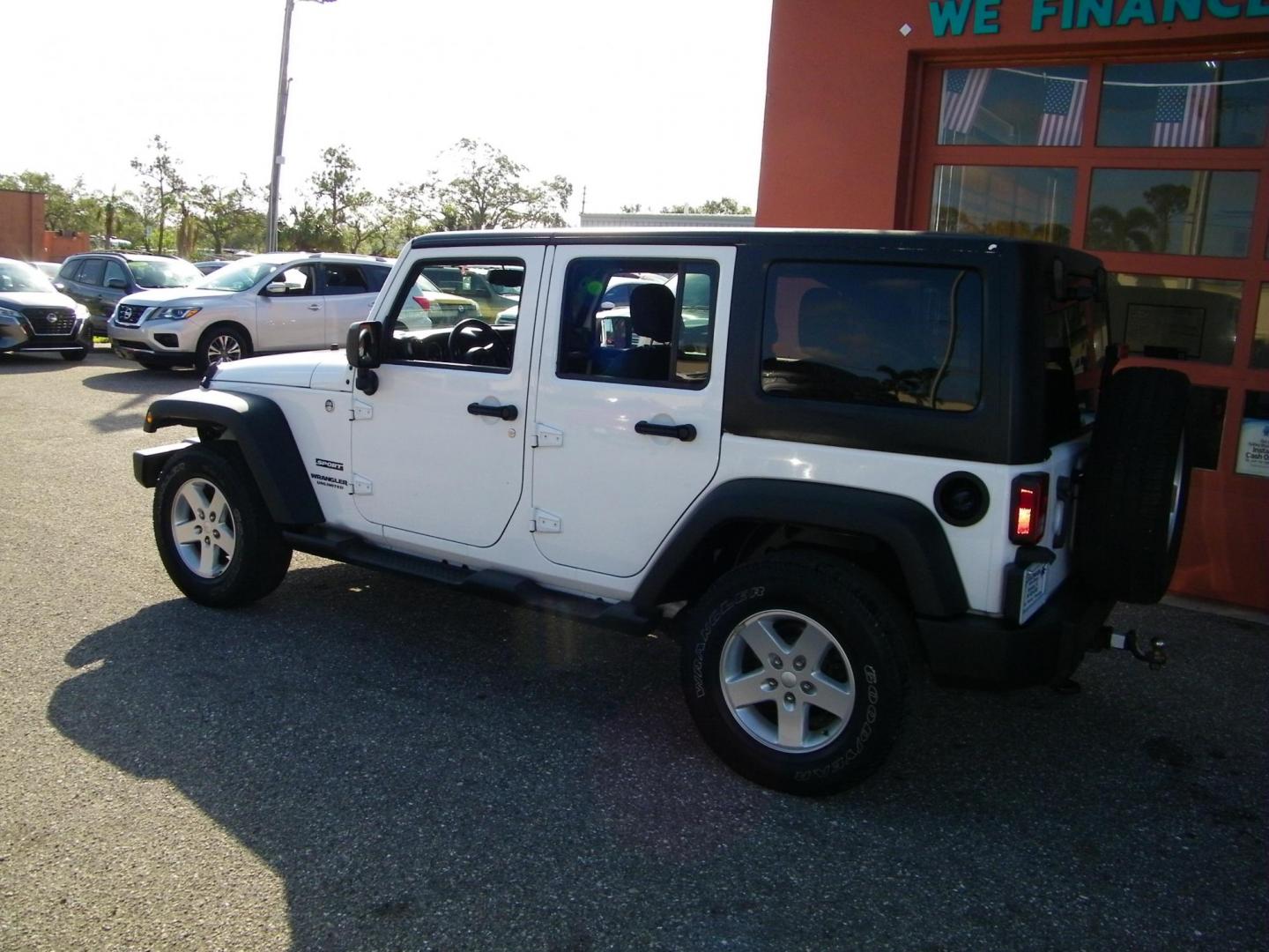 2015 White /Black Jeep Wrangler Unlimited Sport 4WD (1C4BJWDG4FL) with an 3.6L V6 DOHC 24V FFV engine, Automatic transmission, located at 4000 Bee Ridge Road, Sarasota, FL, 34233, (941) 926-0300, 27.298664, -82.489151 - Photo#4