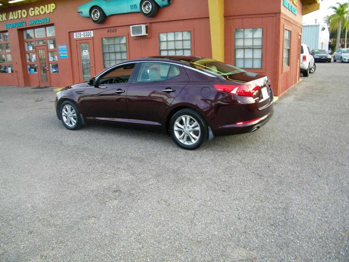 2013 Maroon /Beige Kia Optima EX (5XXGN4A77DG) with an 2.4L L4 DOHC 16V engine, 6-Speed Automatic transmission, located at 4000 Bee Ridge Road, Sarasota, FL, 34233, (941) 926-0300, 27.298664, -82.489151 - Photo#1